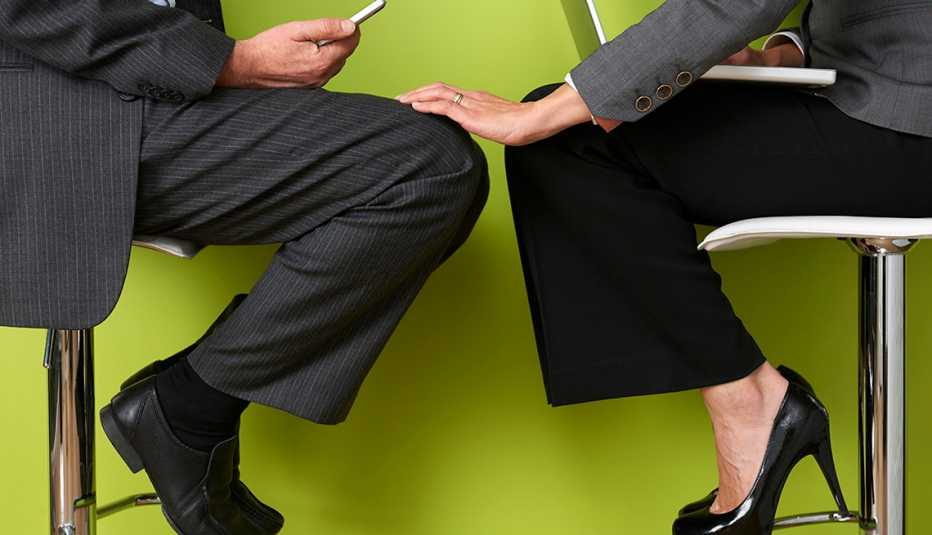 Woman Touching Coworkers Leg, Closer to Coworker Than Spouse