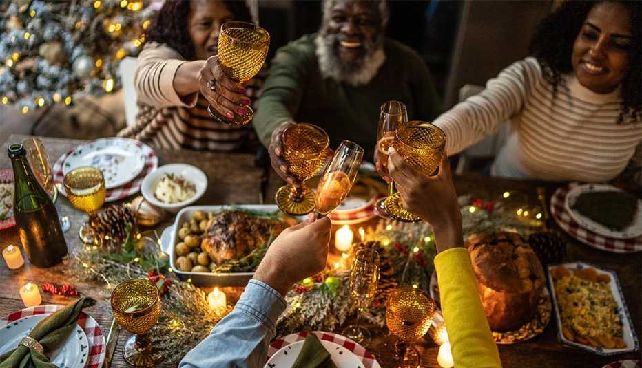 Family toasting on Christmas dinner at home