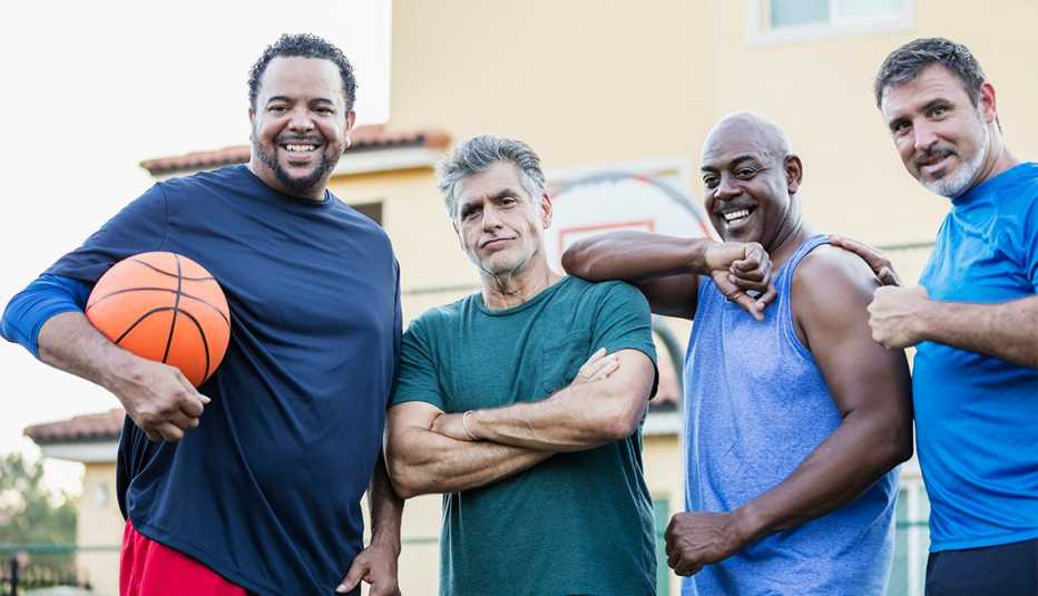 A multi-ethnic group of men on an outdoor basketball court