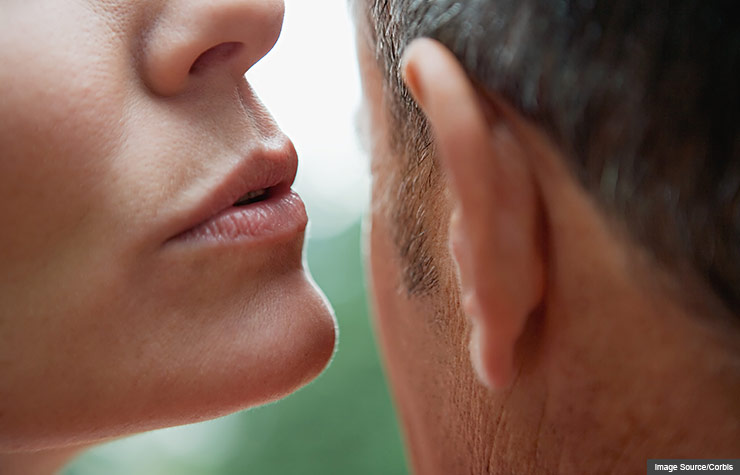 Woman whispering to man, Sex at 50+