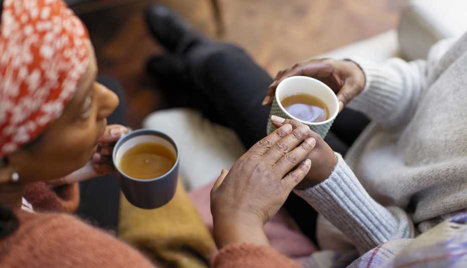 African-American women talking over coffee