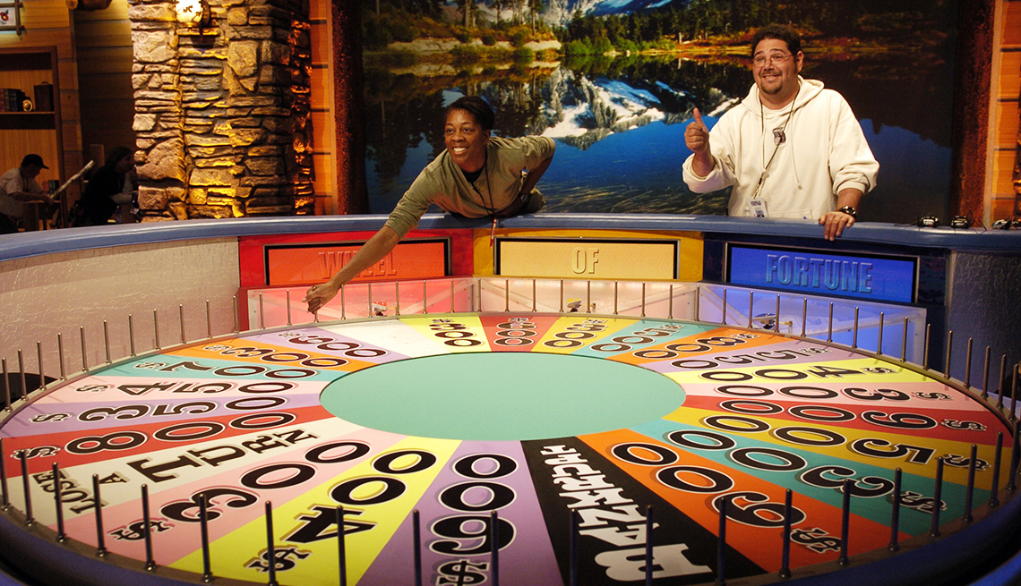 Two contestants on Wheel of Fortune