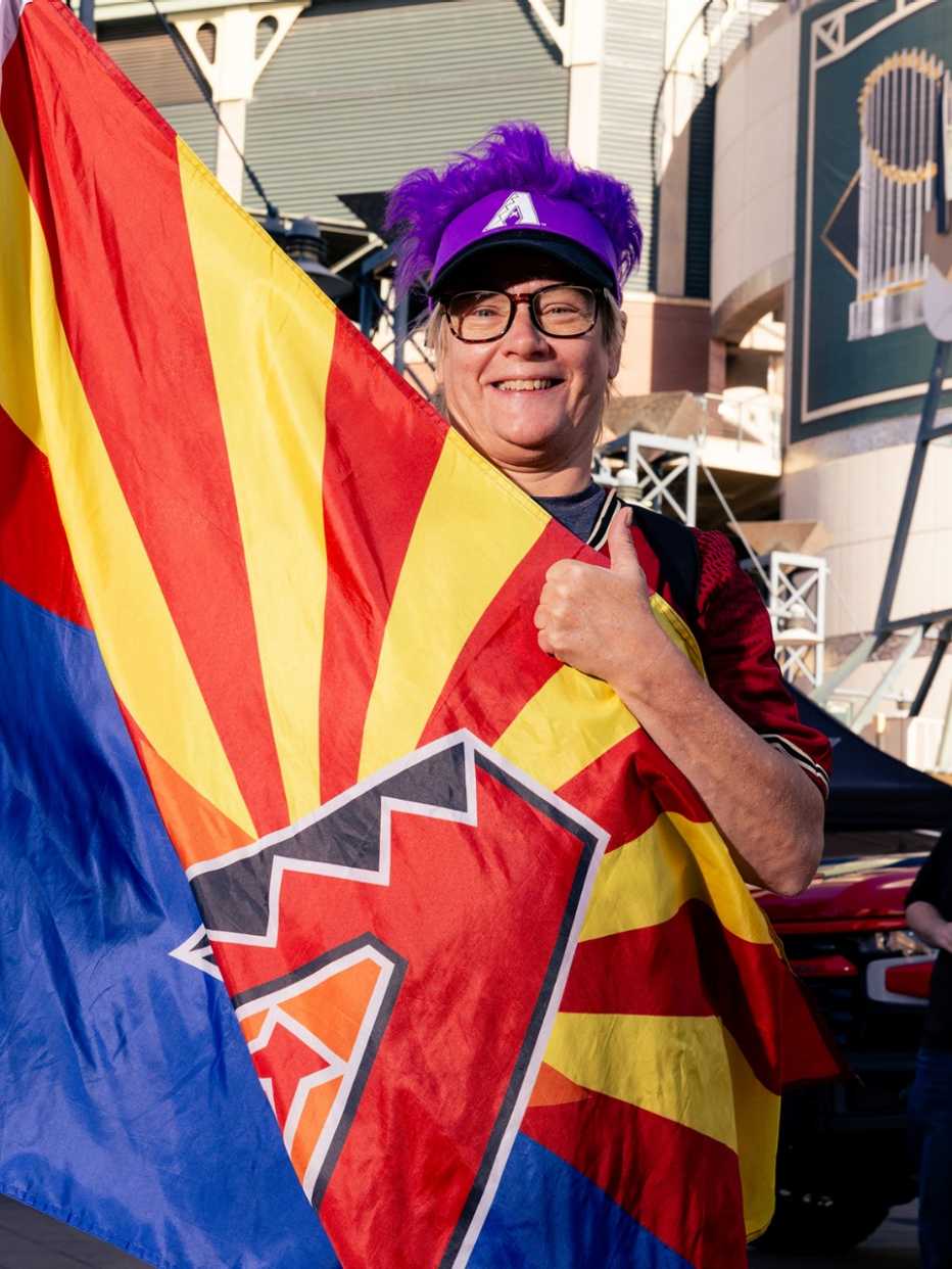 cindy achtzehw holding a diamondbacks flag