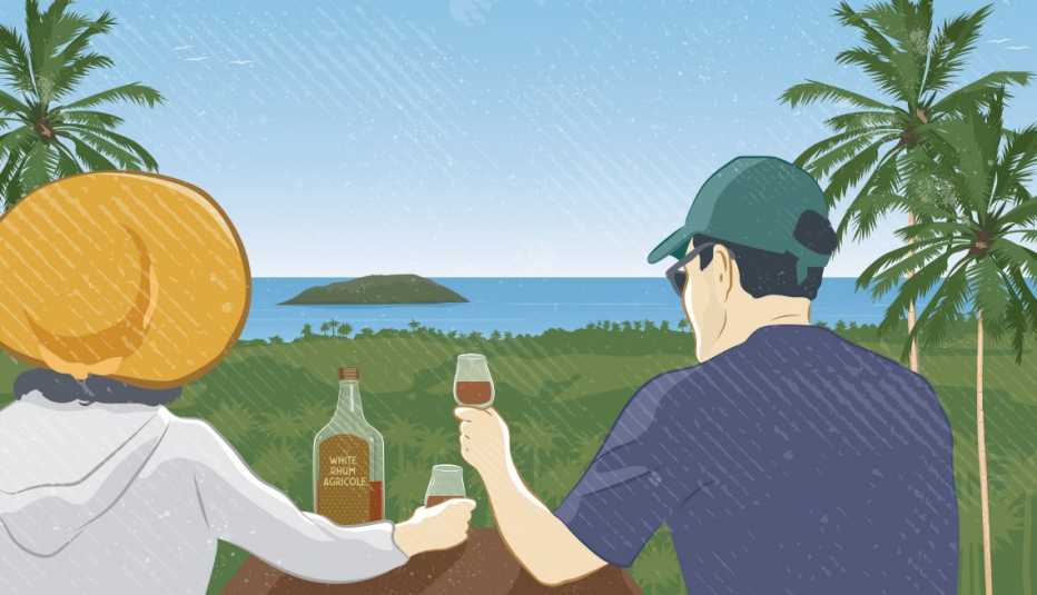 A man and a woman drink rum while gazing at the ocean in Martinique