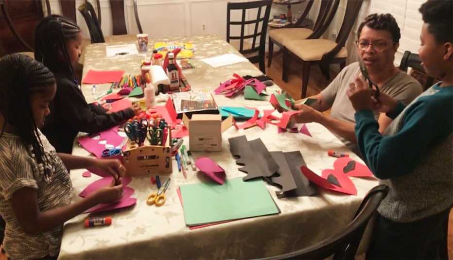 Grandmother doing arts and crafts with grandkids Grandmother doing arts and crafts with grandkids