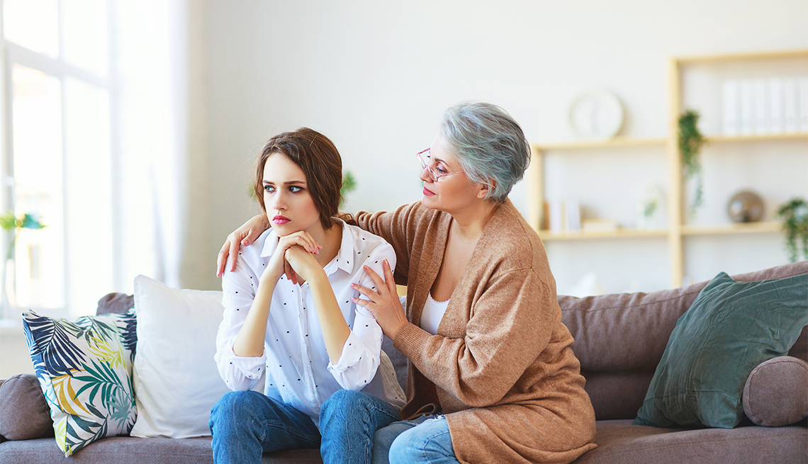 mother comforting teen daughter who appears stressed