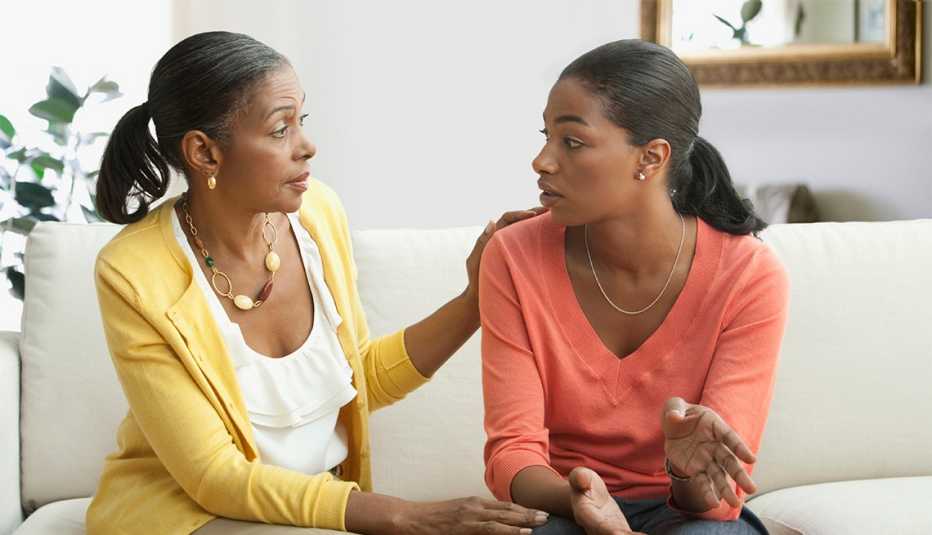 mother and daughter talking in living room