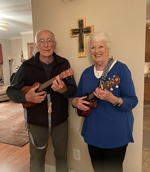 Jo and Don Carson practice the Ukulele