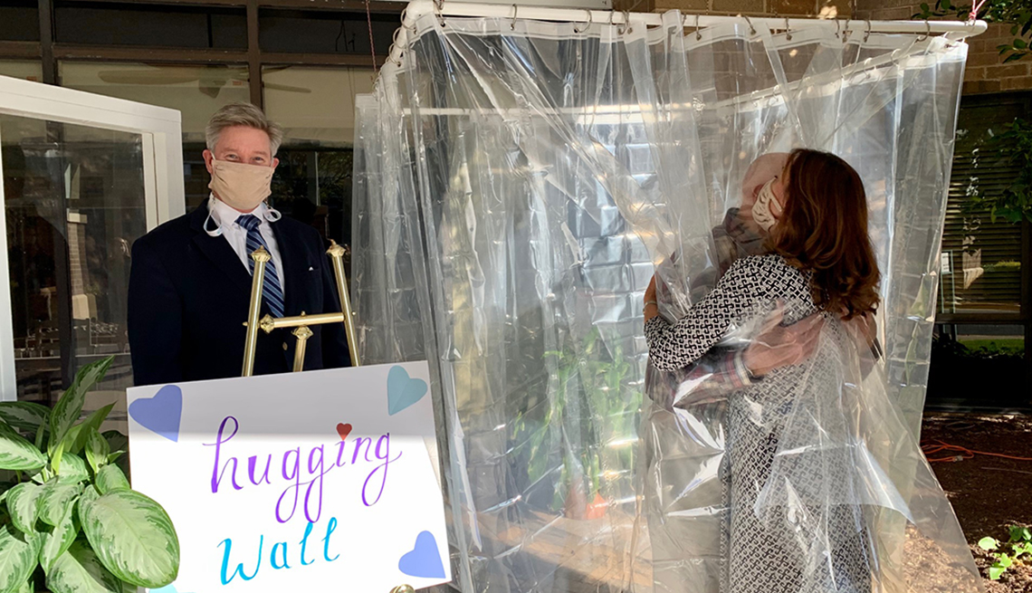 Dr. David Via and a family friend at one of our Hugging Walls.  Ben Unkle is standing next to to the Hugging Wall.