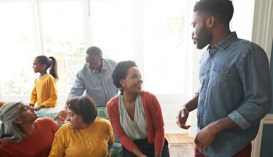 Family and friends enjoying social gathering at home during Christmas