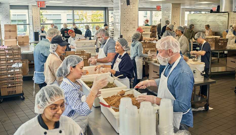 Volunteers working in the God’s Love We Deliver (GLWD) kitchen