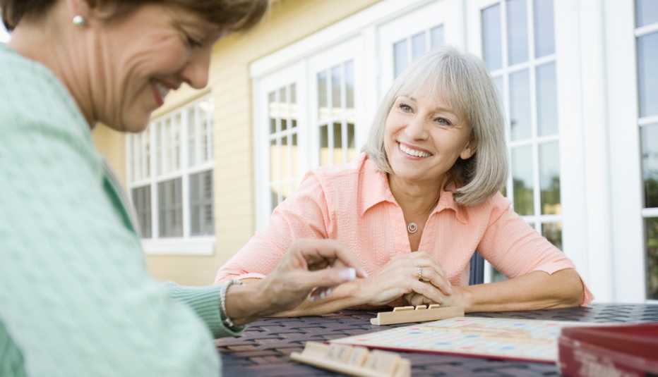 two women playing scrabble