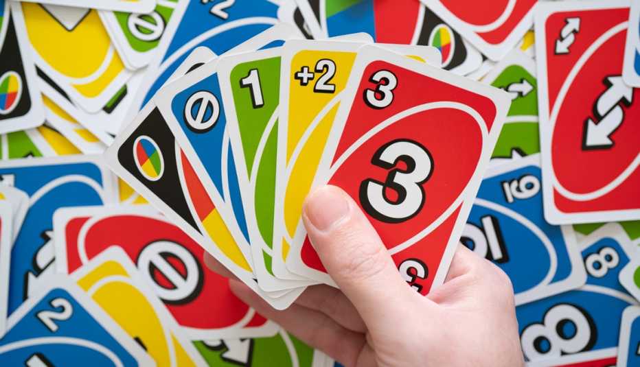 hand holding uno cards