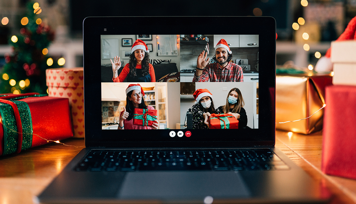 Video call on a laptop screen during Christmas. Celebrating Christmas holidays during Coronavirus Covid-19 pandemic concept. 