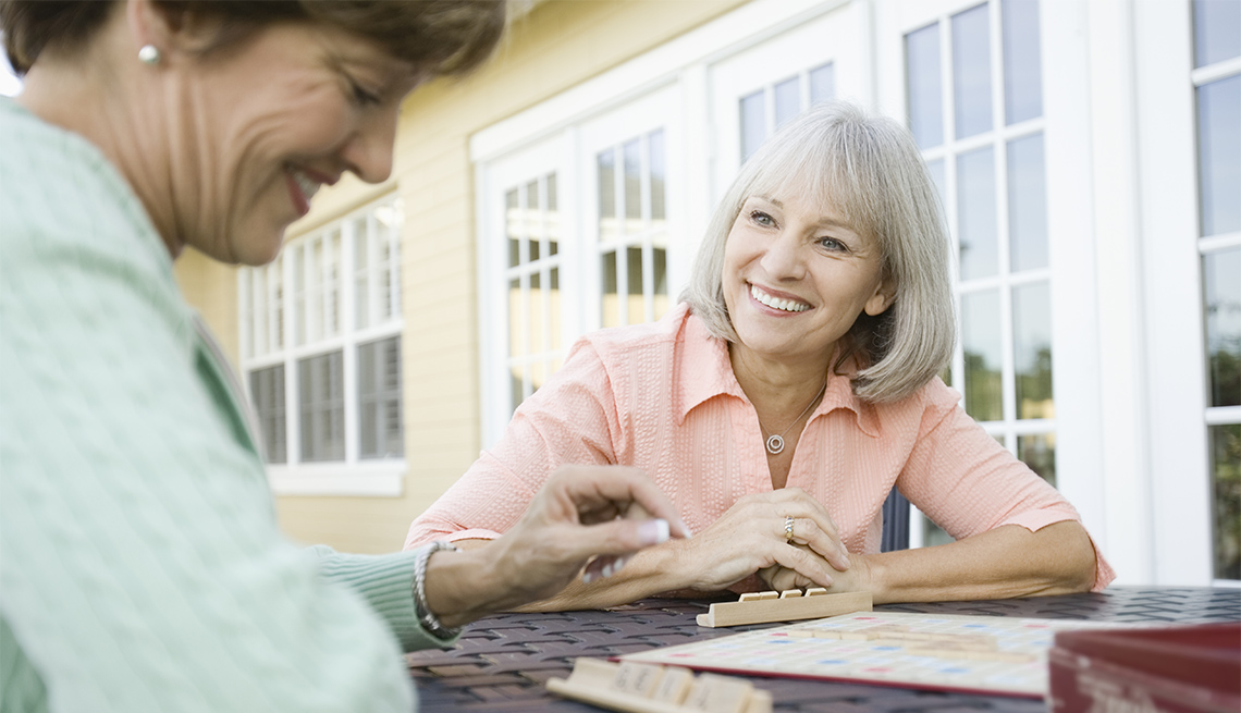 two women playing scrabble