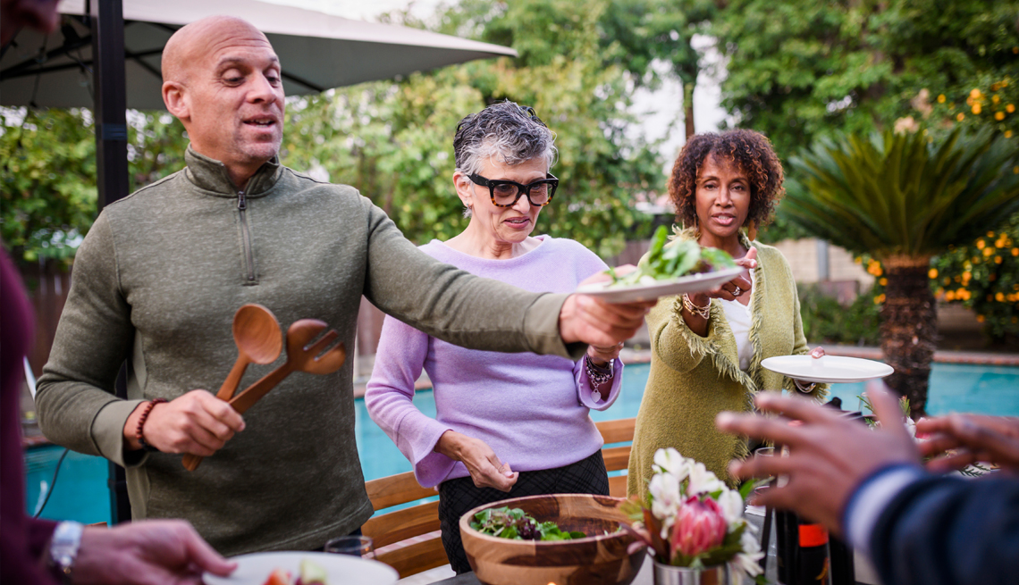 people enjoying a dinner party outside