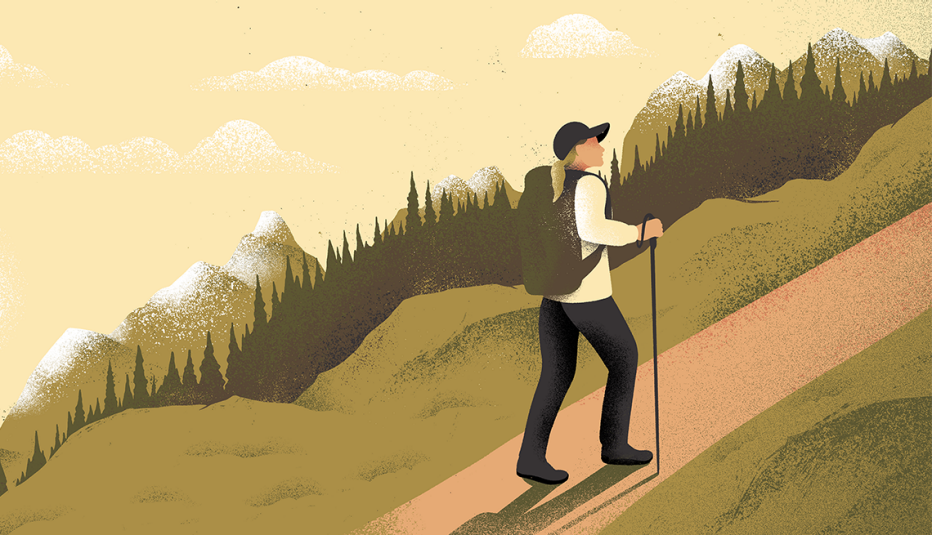 a woman hiking up a hill alone a woman hiking up a hill alone