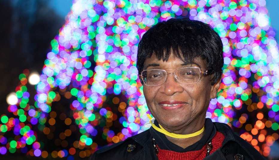 Catherine Townsend, 85, stands in front of a tree she grew from a sapling that was chosen by the City of Chicago for display in Millennium Park for the 2020 Christmas season.
