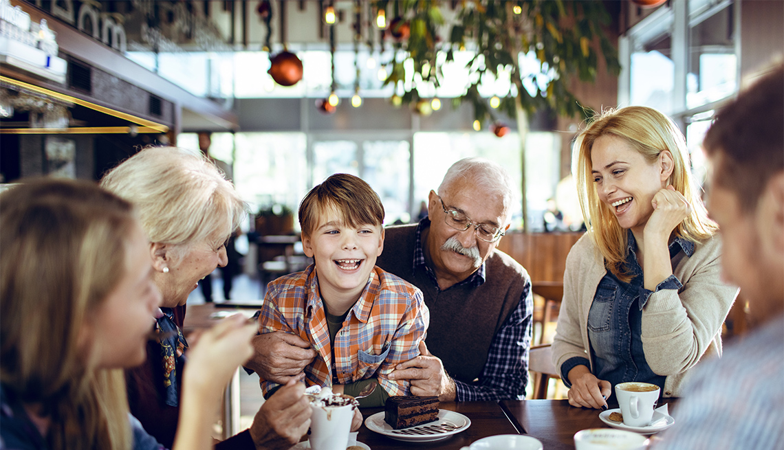 Close up of a multi generational family spending time during the holidays together in a cafe