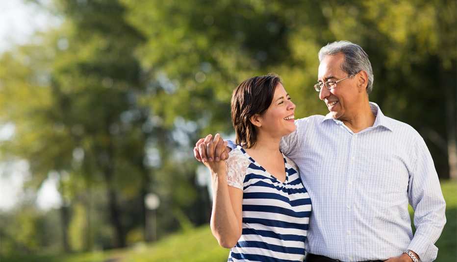 Loving happy couple together at walk in a park