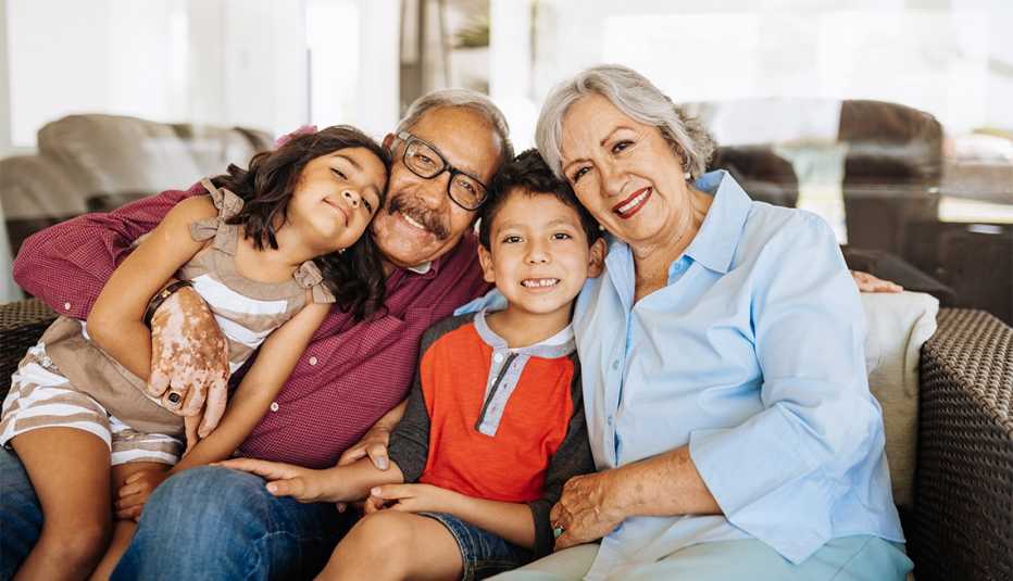 Couple enjoying weekend with their grandchildren and family at home 
