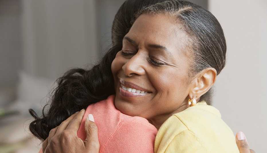 Mom and daughter embrace