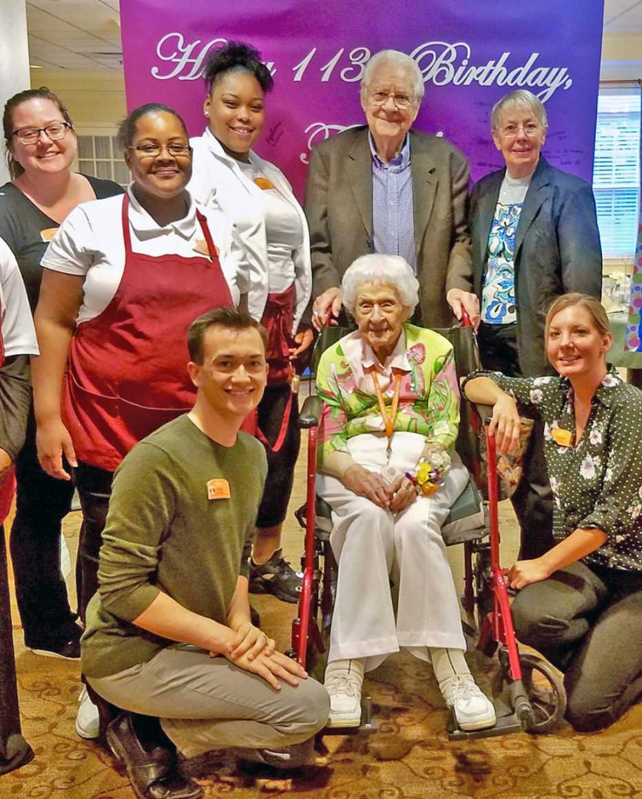 thelma sutcliffe at her one hundred and thirteenth birthday celebration surrounded my family and staff at brighton gardens senior living facility in omaha nebraska