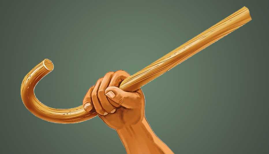 hand and forearm holding a cane up in the air
