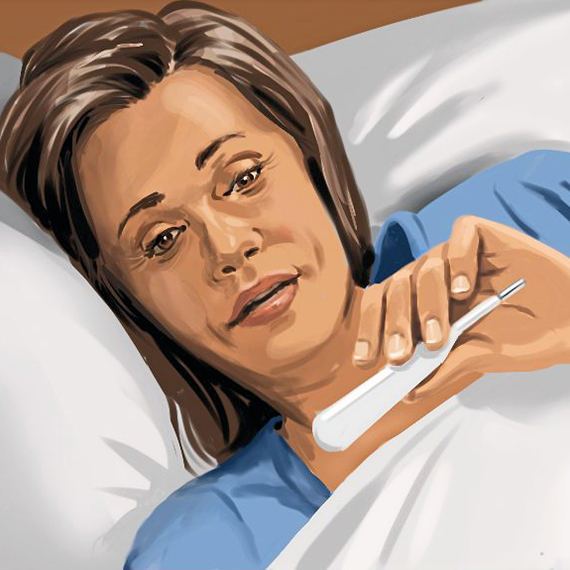 woman lying sick in bed is checking her temperature