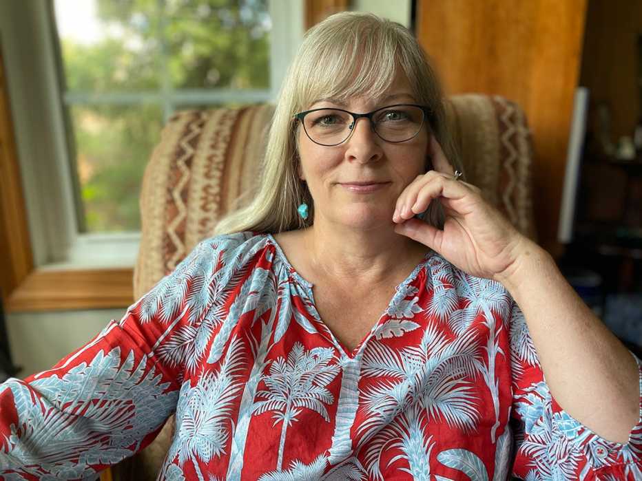 portrait of beth bruno sitting in a chair