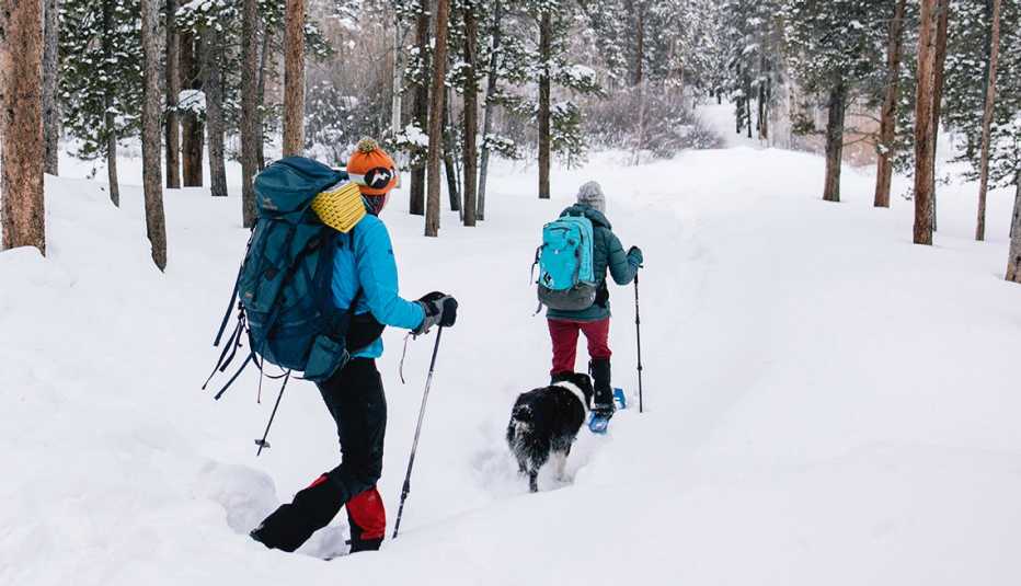  It's important to wear gear, such as leg gaiters, to stay warm and dry when snowshoeing in deep snow.