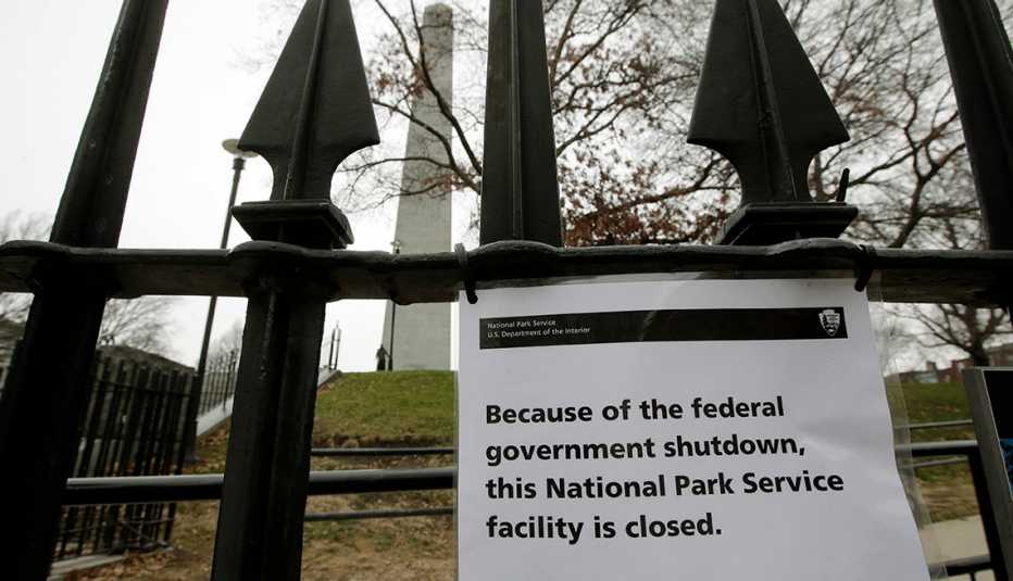 A park outside of Boston with a sign saying it's closed. A park outside of Boston with a sign saying it's closed.