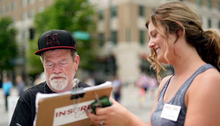 Man signs a petition to expand Medicaid in Nebraska