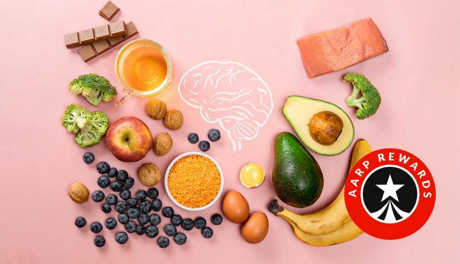 An overhead view of good food for your brain health on a pink background