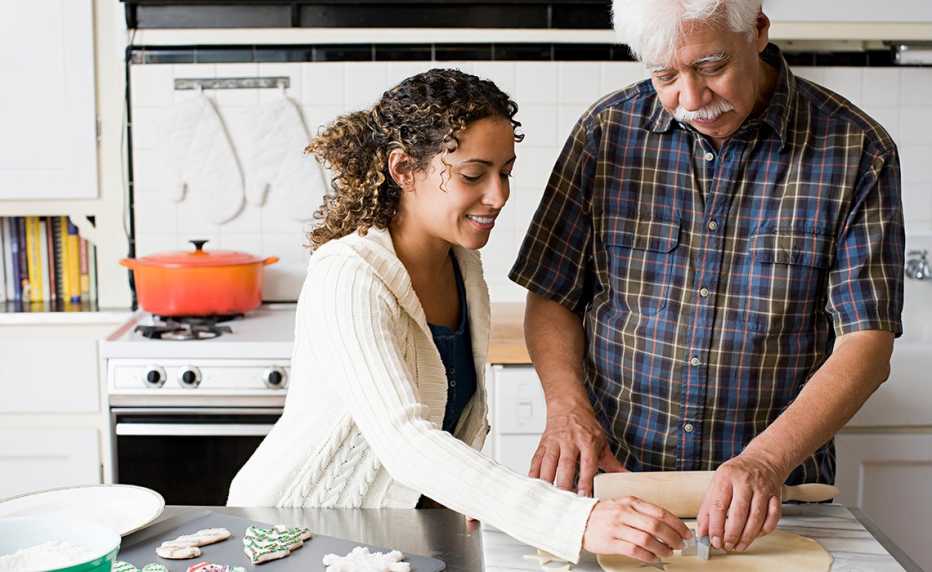 a man and a woman cooking in a kitchen a man and a woman cooking in a kitchen