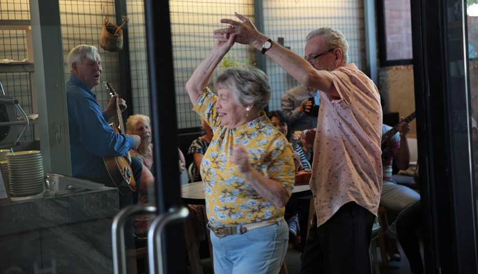 a couple dancing at a cafe a couple dancing at a cafe
