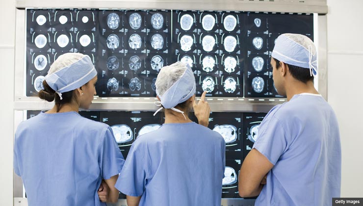 Doctors review x-rays in a hospital.