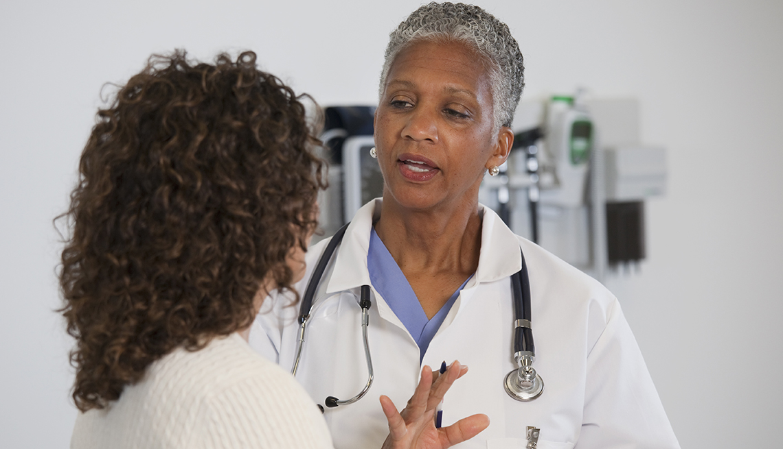 doctor talking to a female patient