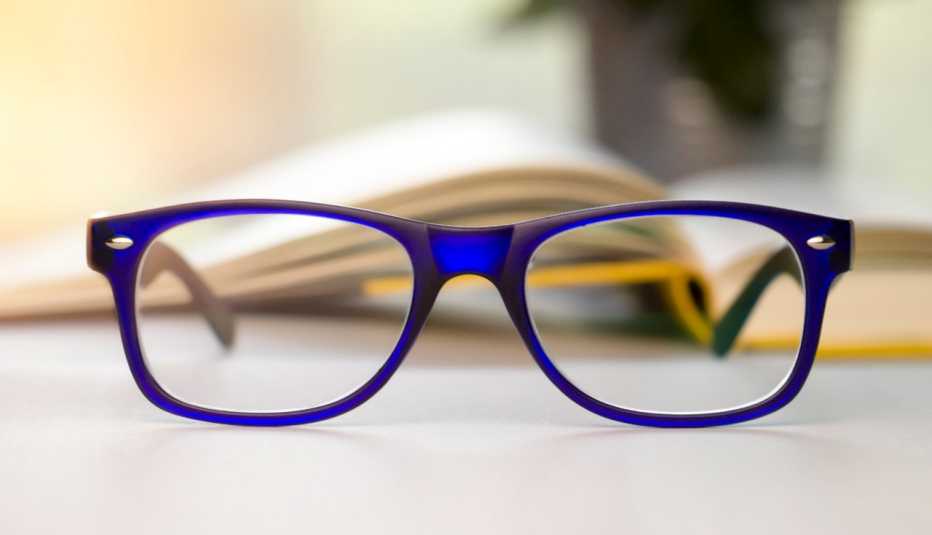 Stylish blue glasses on a blur background. Stylish blue glasses on a blur background.