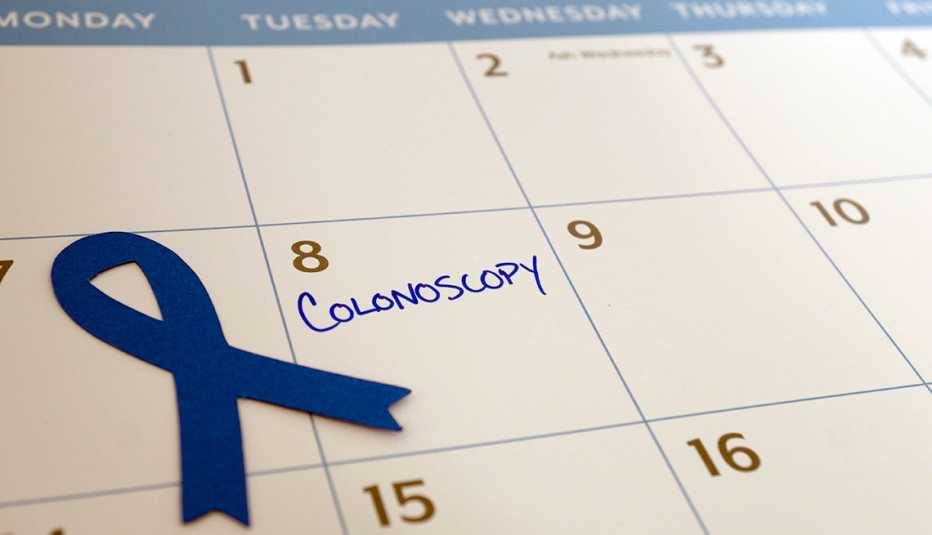Colonoscopy appointment marked on the calendar during March, which is Colon Cancer Awareness month represented by the blue ribbon