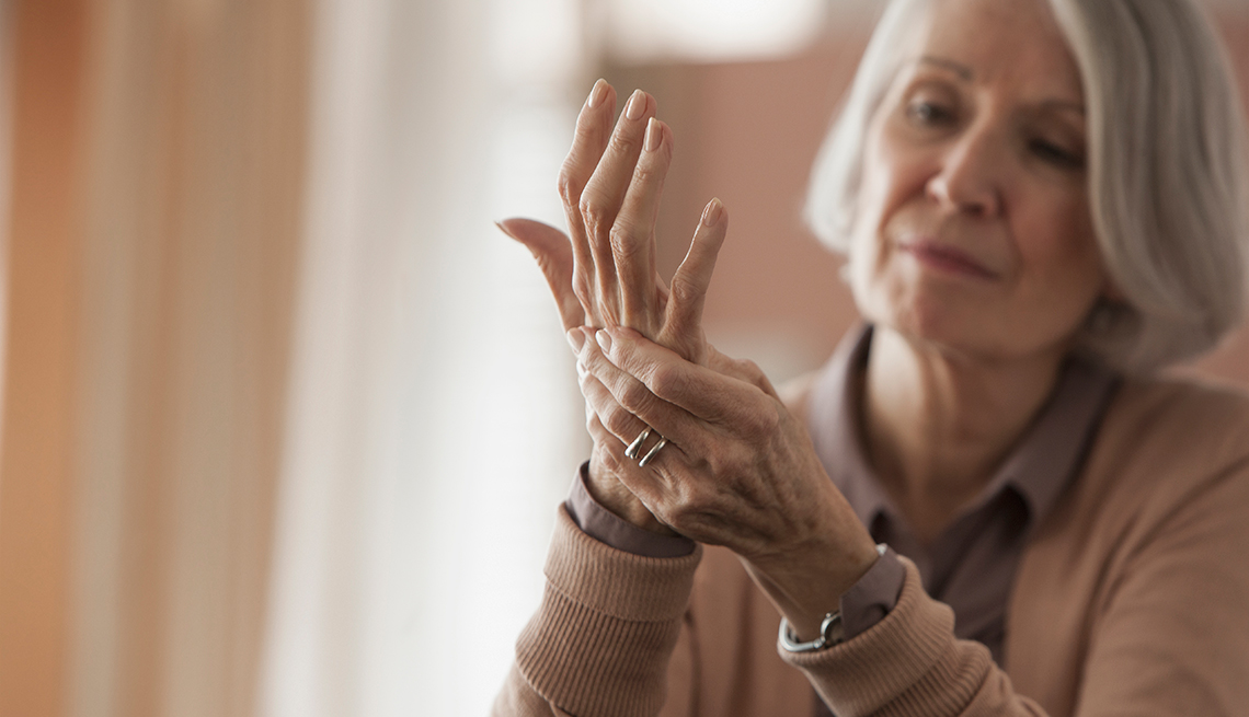 Senior Caucasian woman rubbing her hands