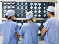 Doctors review x-rays in a hospital.