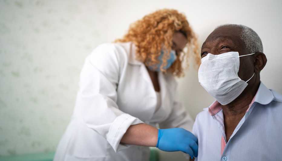 Medical provider gives a man a vaccine 