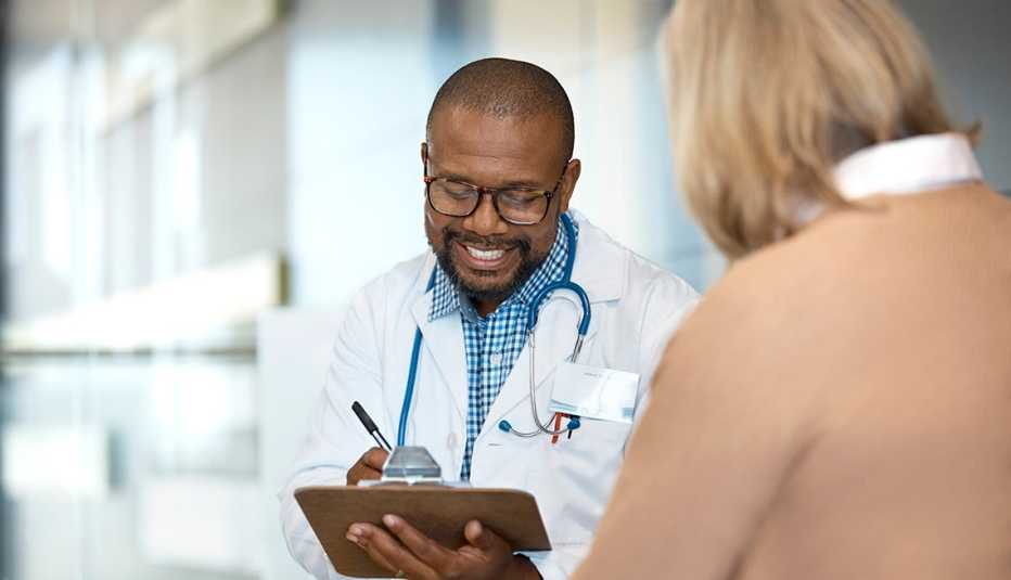 doctor discussing with patient in hospital 