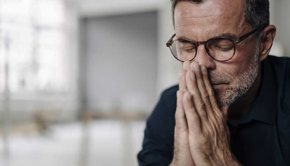 Portrait of mature businessman with closed eyes