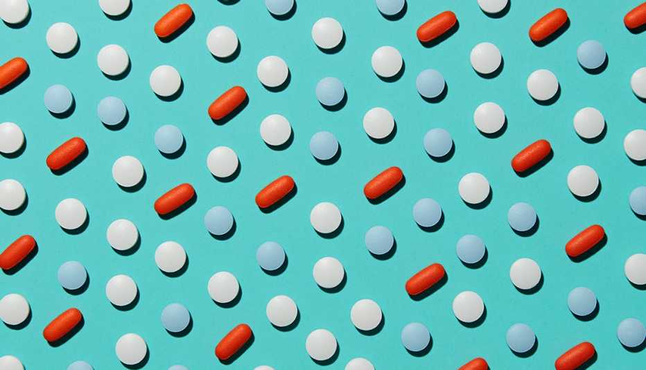 Multicolored Pills on a Blue Background