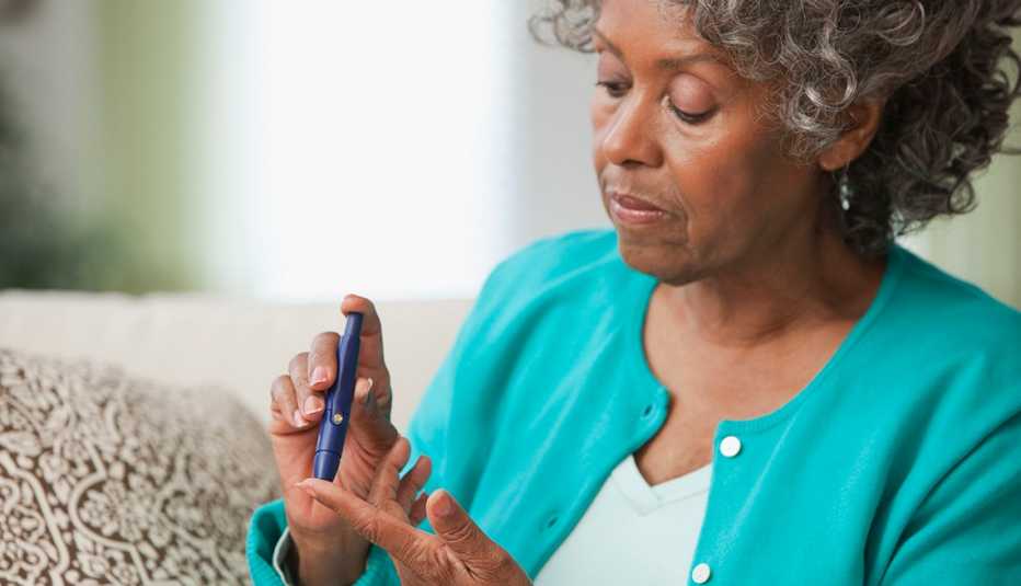 woman checking her blood sugar