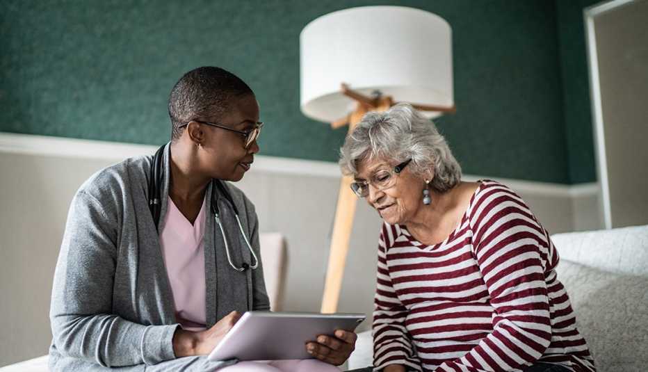 A doctor helping a Parkinson's disease patient