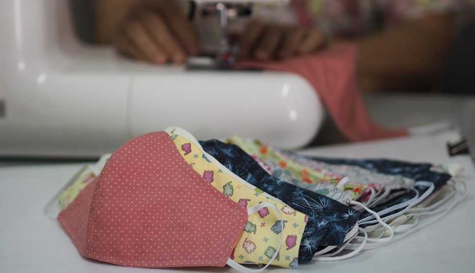 Woman sewing home made face masks to prevent illness during the coronavirus