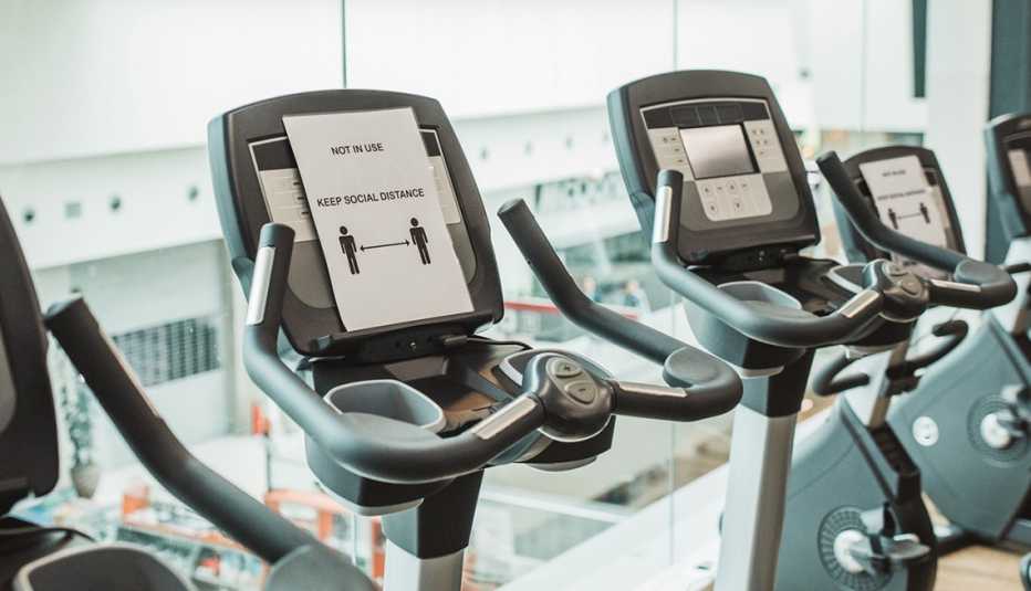 A treadmill with a social distance sign on it A treadmill with a social distance sign on it